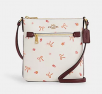 Coach: Mini Rowan File Bag With Bow Print for $79, More