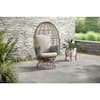 StyleWell Brown Wicker Outdoor Swivel Patio Egg Lounge Chair with Beige Cushions and Black/Cream Pattern Pillows
